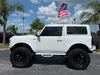 2022 Ford Bronco V6 BAYSHORE WHITEOUT 5" LIFT LEATHER 37" NITTOs | Plant City Florida | Bayshore Automotive 2022 Ford Bronco V6 BAYSHORE WHITEOUT 5" LIFT LEATHER 37" NITTOs | Plant City Florida | Bayshore Automotive